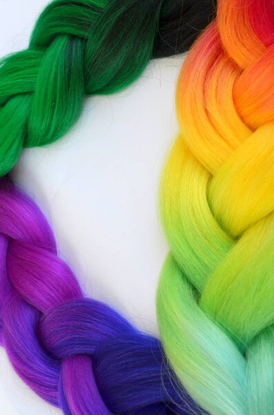Kanekalon. Colored artificial strands of hair. Material for plaiting braids.