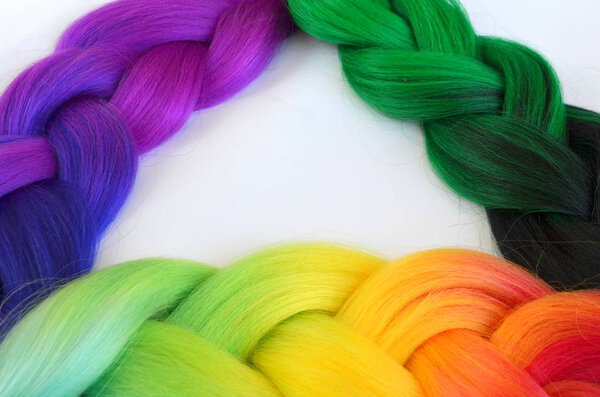 Kanekalon. Colored artificial strands of hair. Material for plaiting braids.