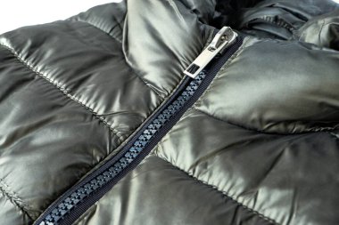 Close-up zipper closure on a light warm olive-colored jacket. Warm clothes, accessories for outerwear. clipart