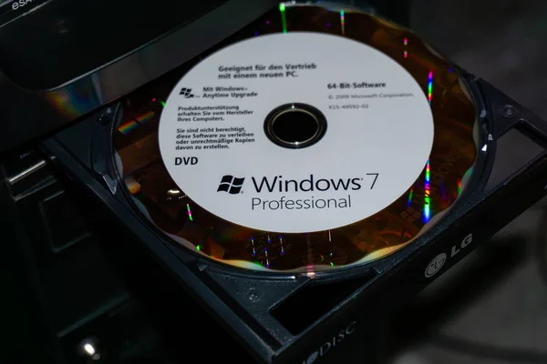 WILDFLECKEN, BAVARIA, GERMANY - JANUARY 11, 2020 An original Microsoft Windows 7 DVD in a DVD drive — Stock Photo, Image