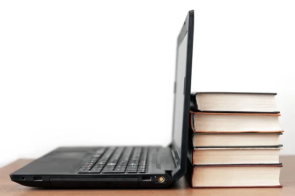Modern computer or old books — Stock Photo, Image