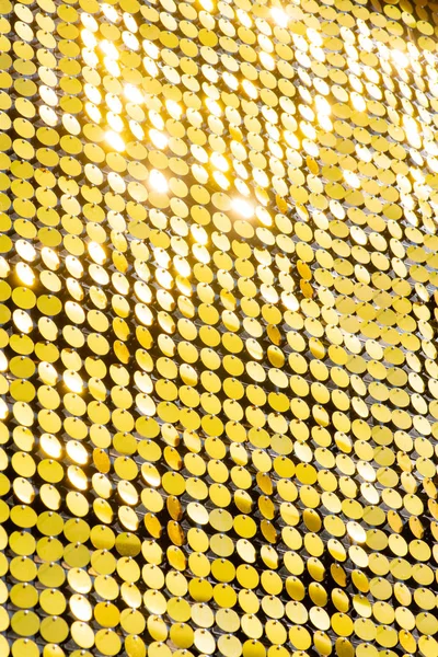 Sequins reflecterende achtergrond. gouden pailletten, sprankelend, — Stockfoto