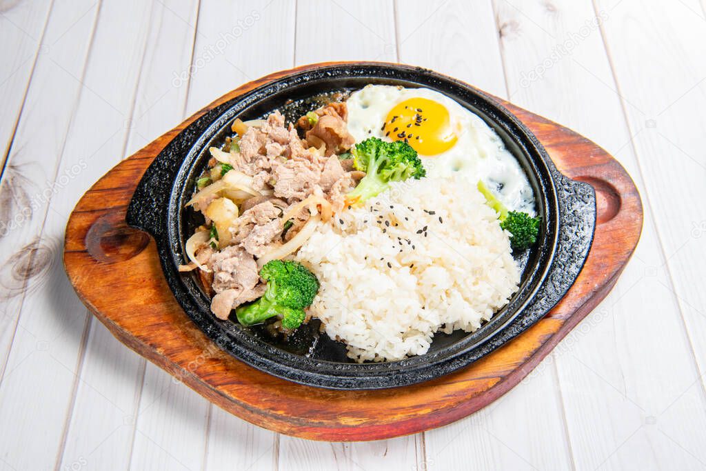 Korean-style teppanyaki with rice, eggs, vegetables,  grilled meat
