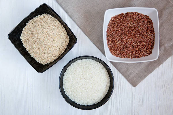 Different Types Rice Cups Table White Brown Red — Stock Photo, Image