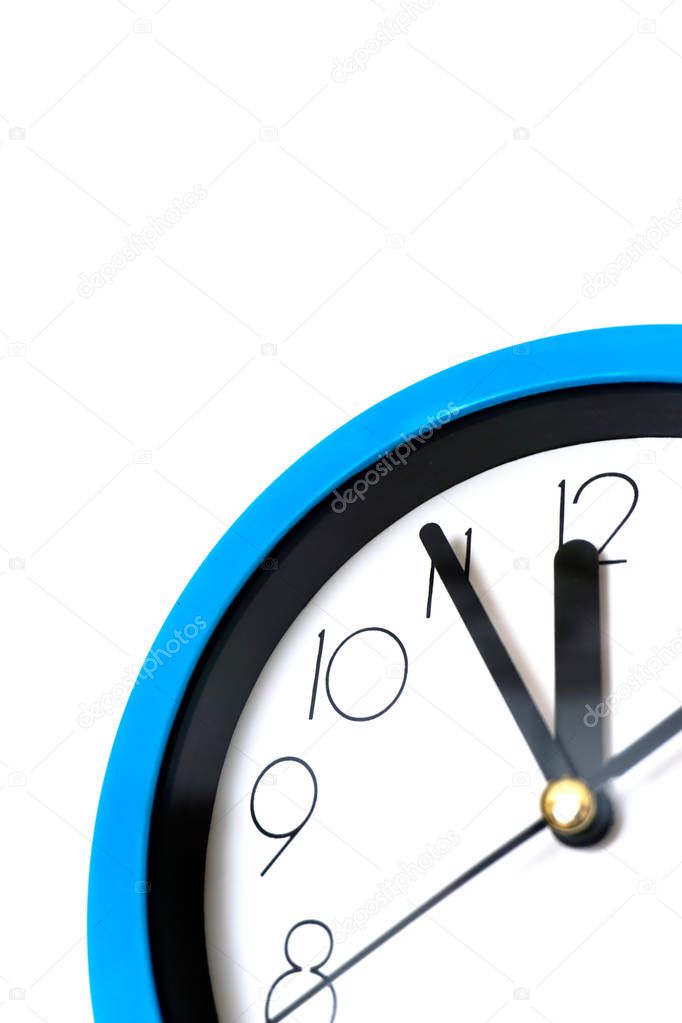 Blue wall clock isolated on white background.
