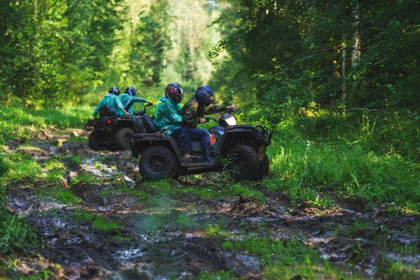 Summer Activities for adults - a trip on quad bikes on the dirty road.
