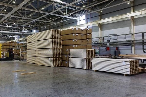 Modern production and storage room with lumber produced and ready for shipment.