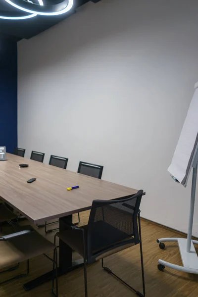 Room for meetings and negotiations in a modern office. Empty corporate room.