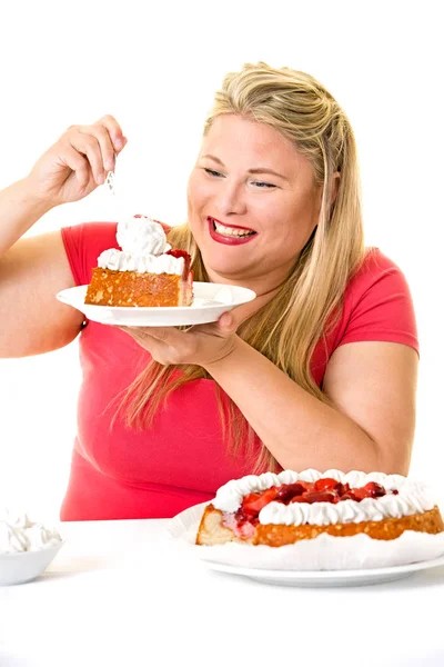 Overweight woman with cake — Stock Photo, Image