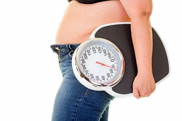 Overweight woman with weight Royalty Free Stock Images