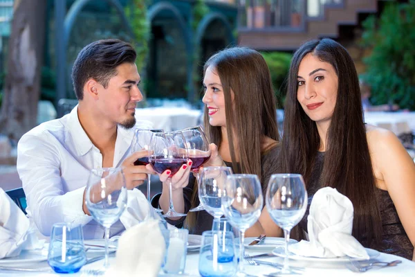 Three friends having dinner — Stock Photo, Image