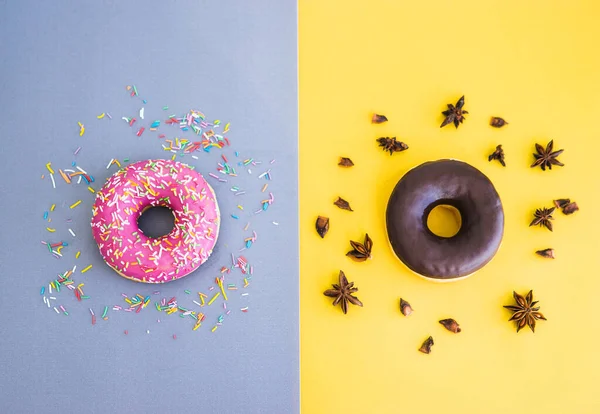 Chocolate and pink doughnuts. National donut day. Minimalism. Delicious pastries.
