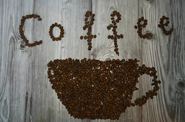 mug made of coffee beans and the inscription coffee