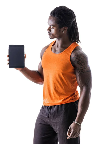 Black young man holding and showing tablet PC — Stock Photo, Image