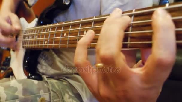 Male hands playing guitar — Stock Video