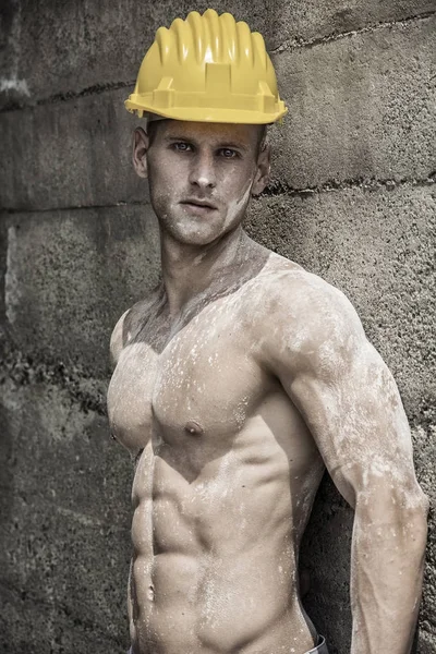 Handsome muscular construction worker standing — Stock Photo, Image