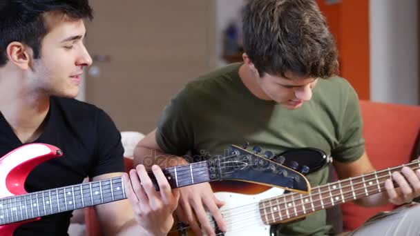 Young men playing electric guitars — Stock Video