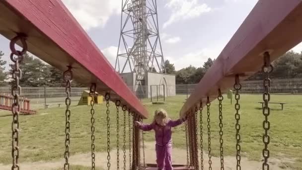 Menina feliz no parque infantil — Vídeo de Stock