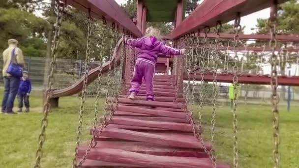 Menina feliz no parque infantil — Vídeo de Stock