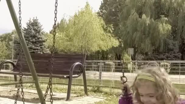 Menina feliz no parque infantil — Vídeo de Stock