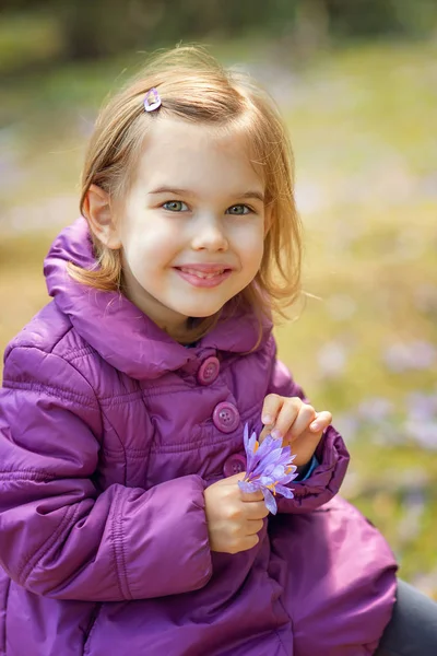 Girl with crocuses — Stock Photo, Image