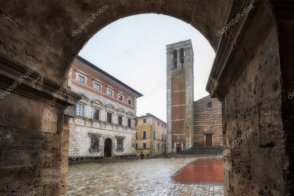 Rainy view of empty medieval Piazza Grande - main square in Montepulciano, Italy with Cathedral of Santa Maria Assunta