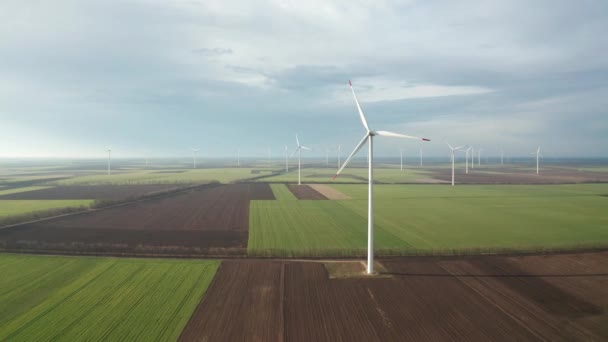 Aerial Fly Wind Turbines Spring Agricultural Field Clean Renewable Wind — Stock Video