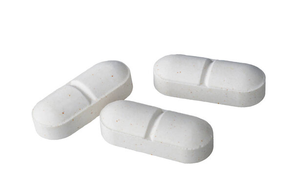 Белые таблетки лекарства изолированы на белом фоне
