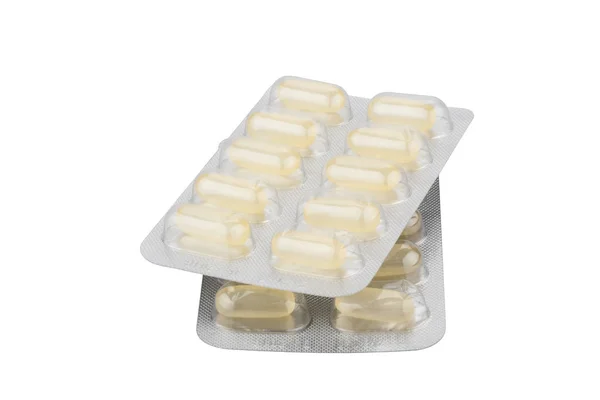 Medical pills in silver blister packs isolated on white backgrou — Stock Photo, Image