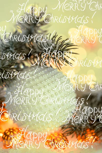 Words Christmas and New Year Holiday greeting card. Beautiful ball, pine branches and a garland in the snow. — ストック写真
