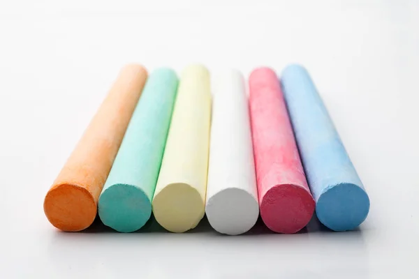 Colored chalks in row — Stock Photo, Image