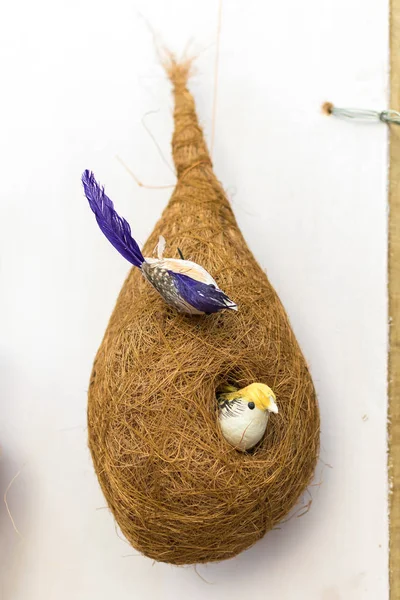 Indian traditional handmade bird with its nest and babies is displayed in a street shop for sale. Indian handicraft and art — Stock Photo, Image