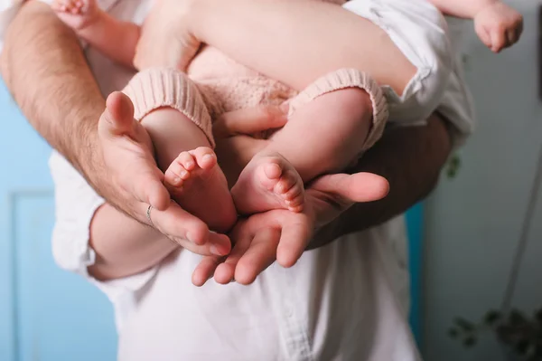 Baby feet in father hands — Stock Photo, Image