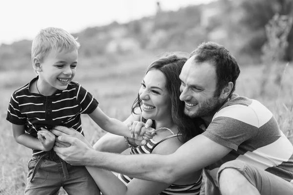 Little boy playing with his parents