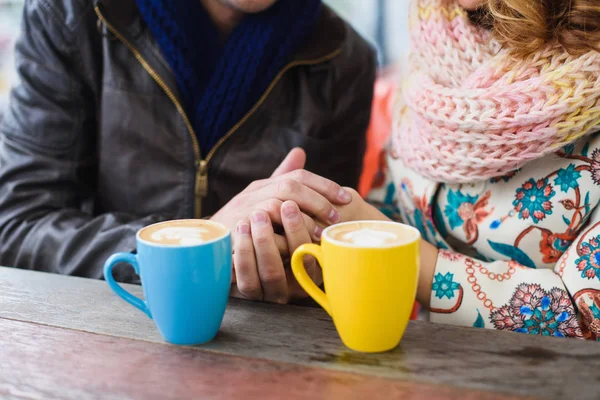 Man and woman drinking coffee