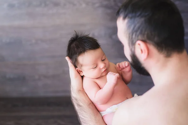 Happy father holding a baby boy — Stock Photo, Image