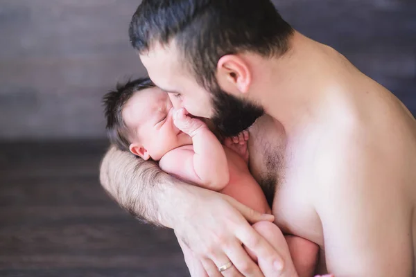 Happy father holding a baby boy — Stock Photo, Image