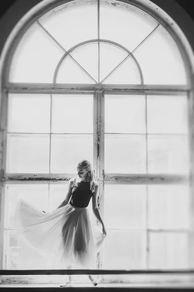 Ballerina dancing at window sill background — Stock Photo, Image