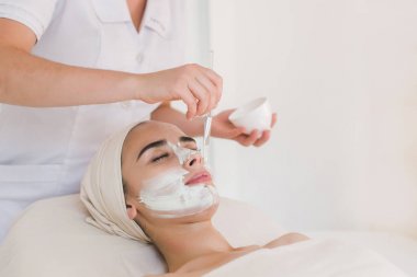 Beauty treatment in spa salon. clipart