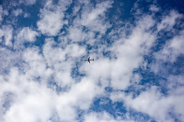 Airplane in cloudy sky — Stock Photo, Image
