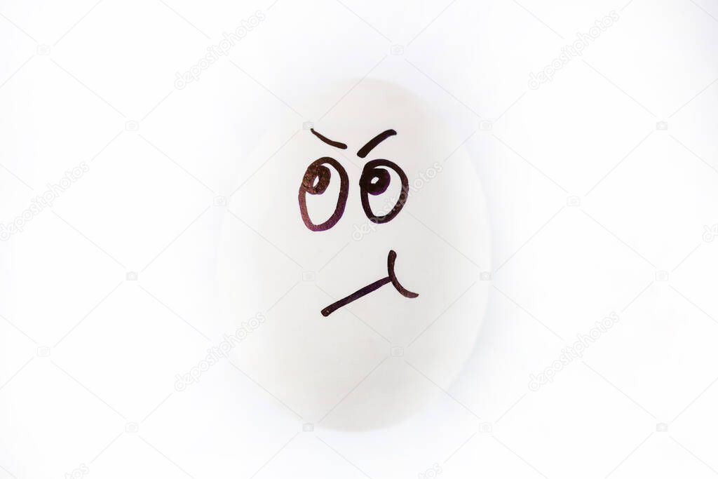 Funny sulky drawn face on Easter egg