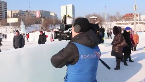 PERM, RUSSIA - FEB 14, 2016: Russian television reporter works in Ice town, Ice town in Perm - traditional winter attraction — Stock Video