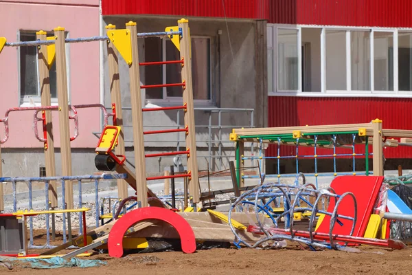 Bright details of new playground near building on construction s — Stock Photo, Image