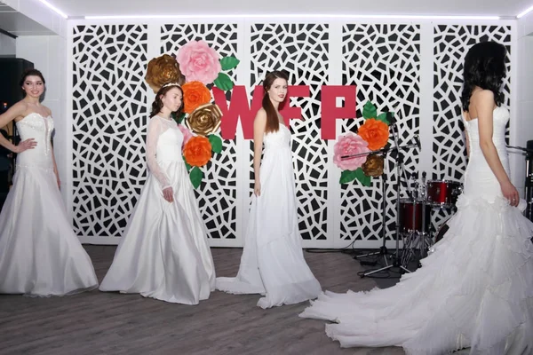 Beautiful models brides on catwalk — Stock Photo, Image