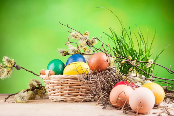 Colorful Easter eggs in a basket — Stock Photo, Image