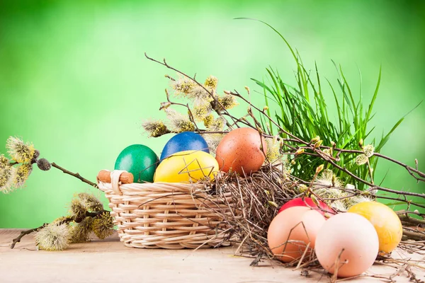 Colorful Easter eggs in a basket — Stock Photo, Image