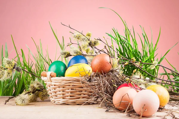 Colorful Easter eggs in a basket — Stock Photo, Image