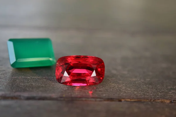 ruby Is a beautiful red gemstone on a wooden floor