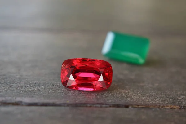 ruby Is a beautiful red gemstone on a wooden floor