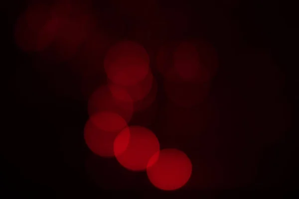 Rotes Bokeh auf schwarzem Hintergrund — Stockfoto